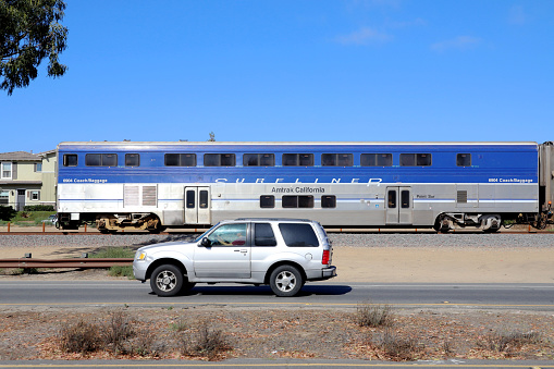 Encinitas, California, USA - July 3, 2022:Amtrak Pacific Surfliner Train passing downtown Encinitas.