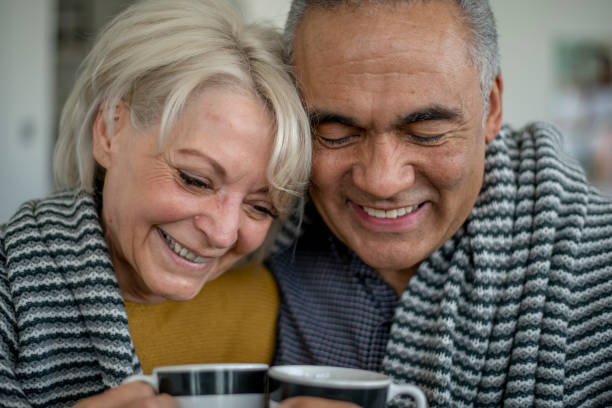istock Senior Couple Cuddling 1407208215