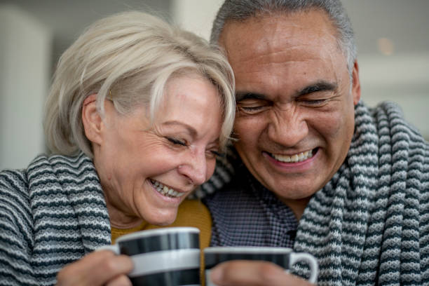 istock Senior Couple Cuddling 1407208216