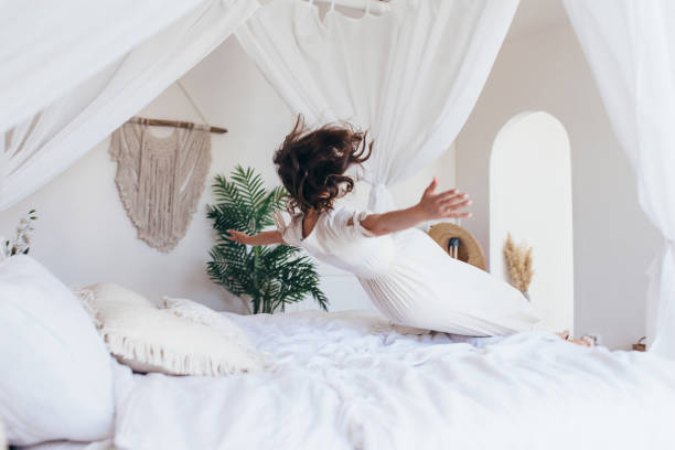istock Woman falls on the bed 1407209210