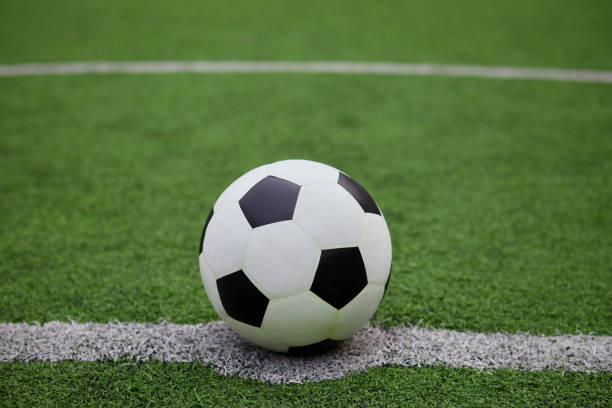istock Football on the grass field 1407213273