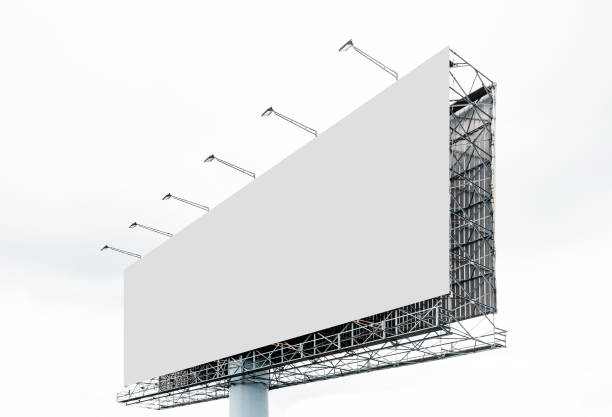 istock Outdoor billboard on blue sky background with white background mock up. clipping path 1407220252