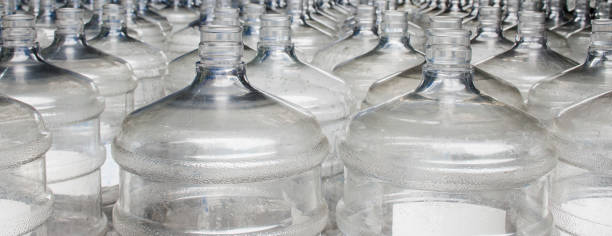 istock Pattern of 19 liter gallon plastic water bottle 1407221137