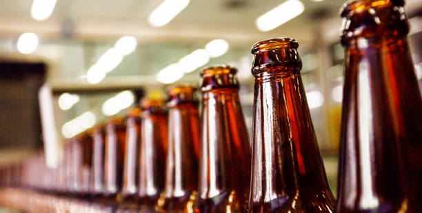 istock Beer bottle in conveyor belt 1407222668