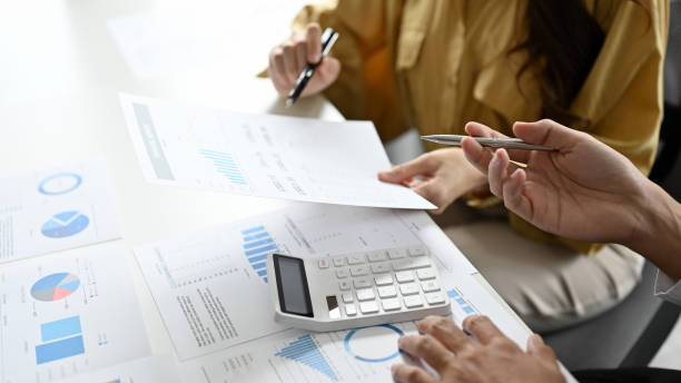 istock Businesspeople working, planning a financial project together. cropped image 1407223618