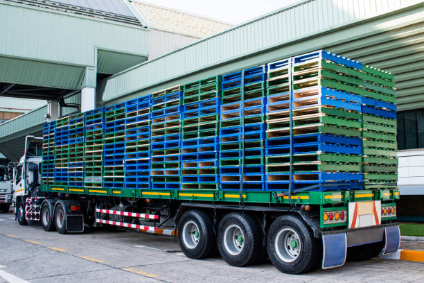 istock Wooden pallets stacked on trailer 1407224051