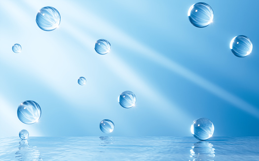 close up of water droplet on blue background