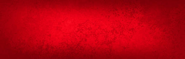 Elegant rich red background texture with black border vignette, cracked grunge texture pattern on mottled painted red background, Christmas color stock photo