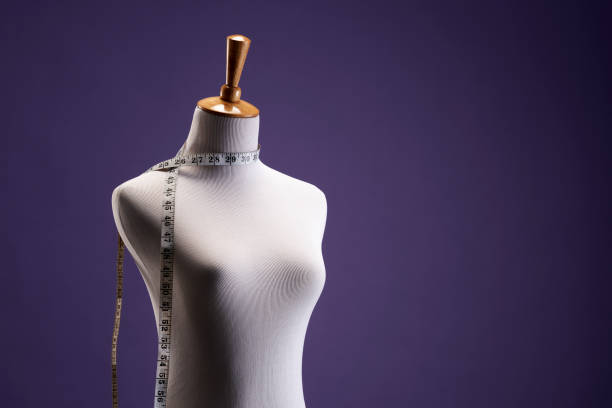istock mannequin , dressmaker's model against purple background 1407235832