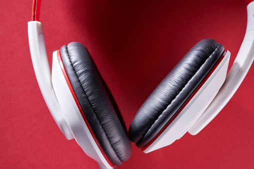 wired headphone against red background