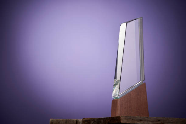 istock crystal trophy against purple background 1407235900
