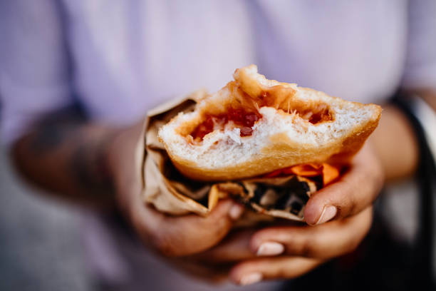 istock Close up of woman's hands holding calzone 1407236687