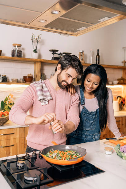 istock Cute Couple Cooking at Home 1407239989