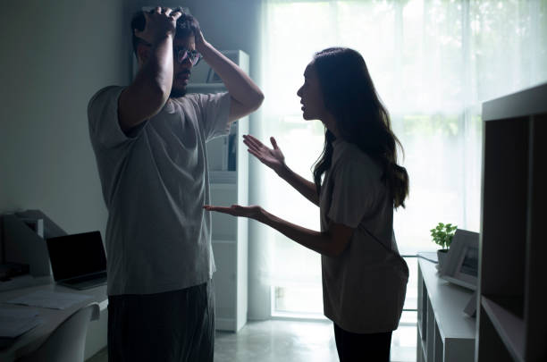 istock Asian couple arguing shouting blaming each other of problem. 1407244609