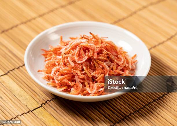 Dried Sakura Shrimps On A Plate Placed On A Bamboo Luncheon Mat Stock Photo - Download Image Now