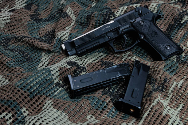 beretta pistol and tactical vest