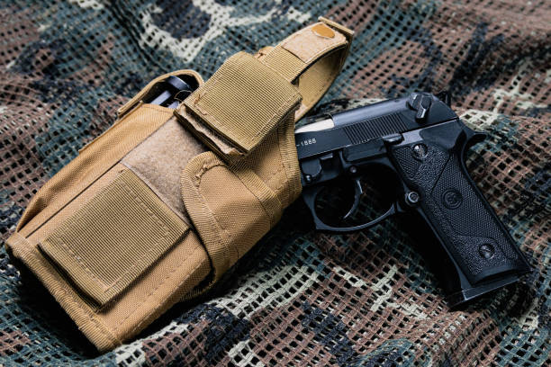 istock beretta pistol and tactical vest 1407250471