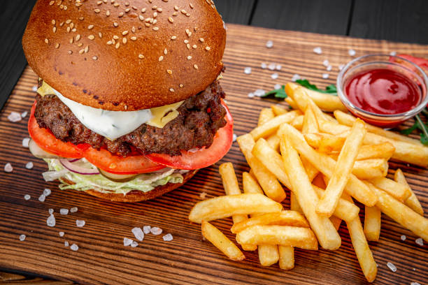 istock An american burger with fried potatoes 1407250504