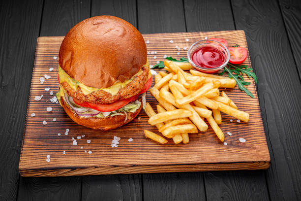 istock Fresh juicy burger with fried potatoes 1407250509