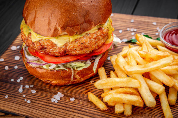 istock Fresh juicy burger with fried potatoes 1407250520