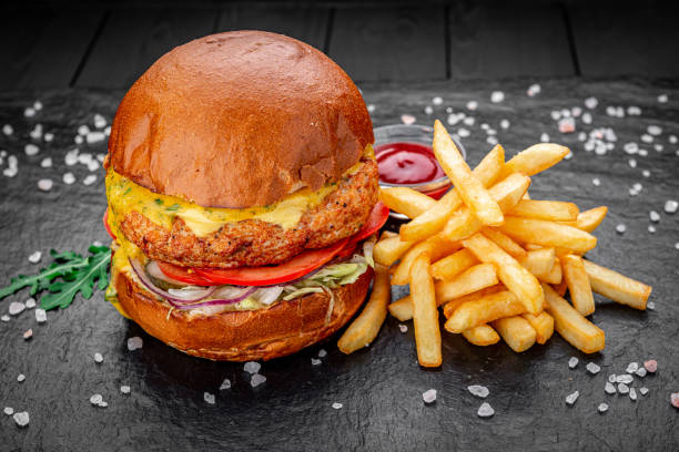 istock Fresh juicy burger with fried potatoes 1407250522