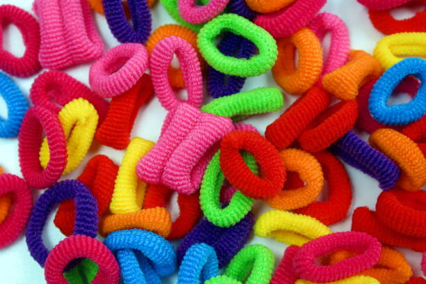 istock A bunch of different bright elastic bands for hair. 1407251435
