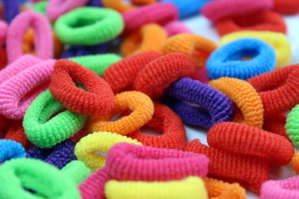 istock A bunch of different bright elastic bands for hair. 1407251522