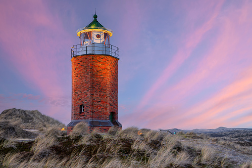 Panoramic image of Kampen lighthouse against evening sky, Sylt, North Frisia, Germany