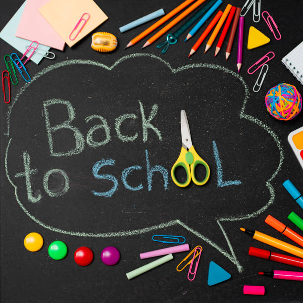 istock School multi-colored supplies, pencils and a drawn cloud with copy space for text. 1407255000