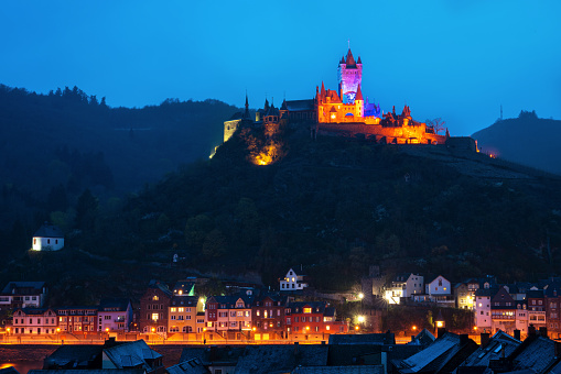 Cochem, Germany - April 1, 2022: Panoramic image of Cochem during blue hour time on April 1, 2022 in Germany