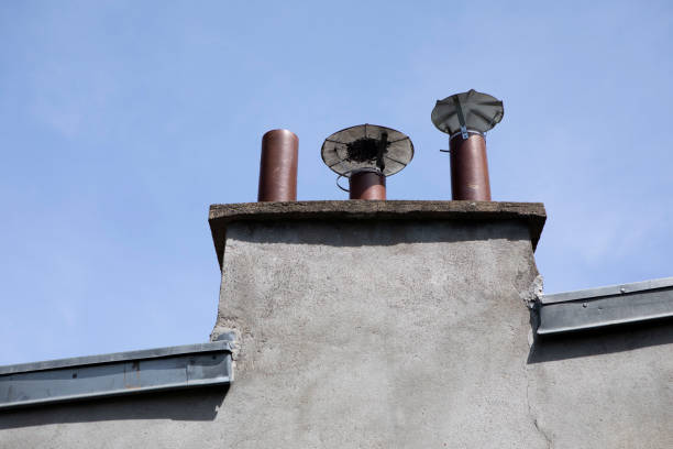 istock Top of chimney against a clear blue sky 1407257479