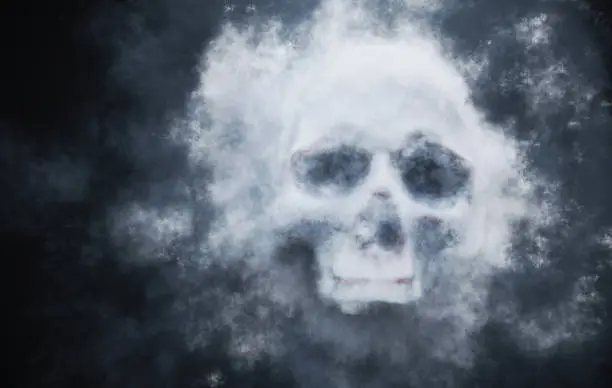 Photo of Spooky skull in smoke. 3D rendered illustration.