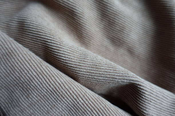 Simple gray corduroy fabric in soft folds Simple gray corduroy fabric in soft folds unprinted stock pictures, royalty-free photos & images