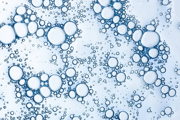 istock Oxygen bubbles in liquid skicare gel serum macro texture background 1407261828