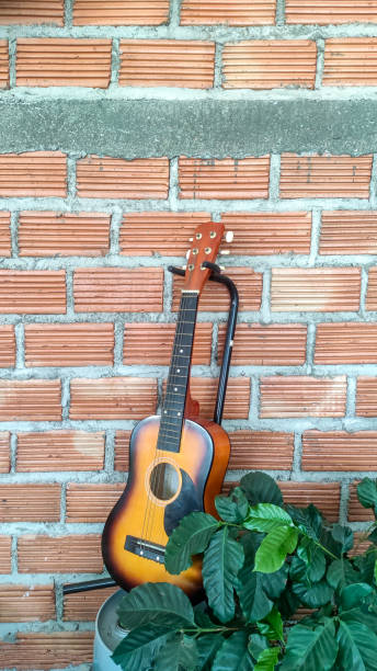 istock The guitar is placed in front of a brick wall. 1407262017