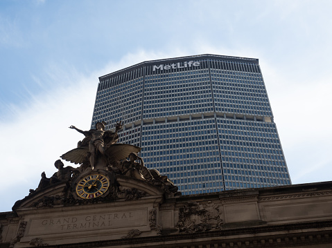 New York, USA - June 24, 2019: Low angle image of the MetLife building and Grand Central Terminal.