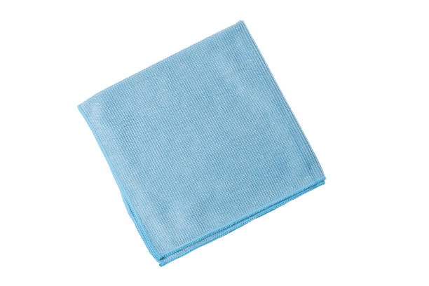 istock Blue cleaning cloth for mirrors, windows and polished surfaces isolated on white background. 1407264435