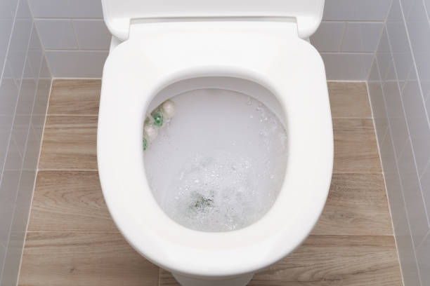 istock Water flushing in toilet bowl with sanitizing wc balls. 1407264795