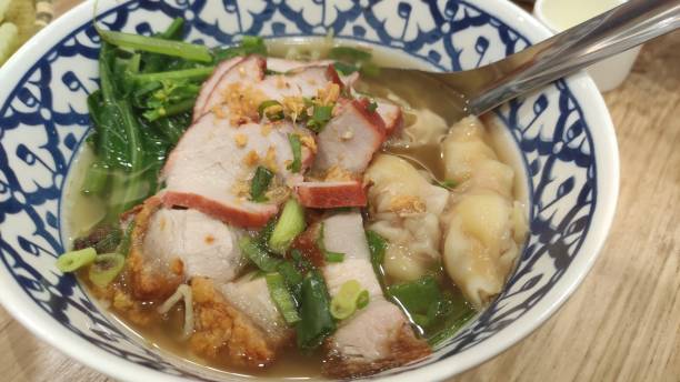 istock Pork dumplings with sliced pork and clear soup 1407267710