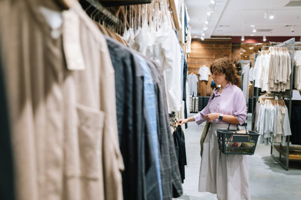 istock Woman Shopping In A Cloth Store 1407268196