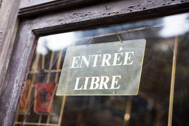 Open sign hanging on a glass doorway