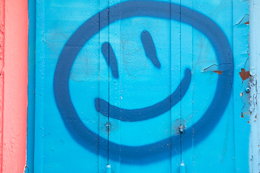 Spray painted anthropomorphic smiley face