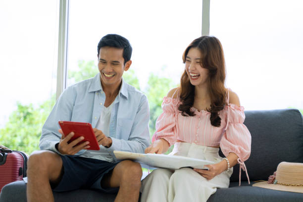 istock Young couple is preparing for travel. 1407274412