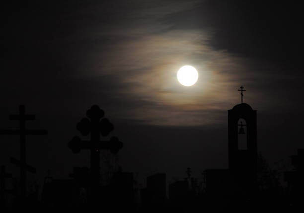 istock Full moon in the night cemetery sky 1407277145