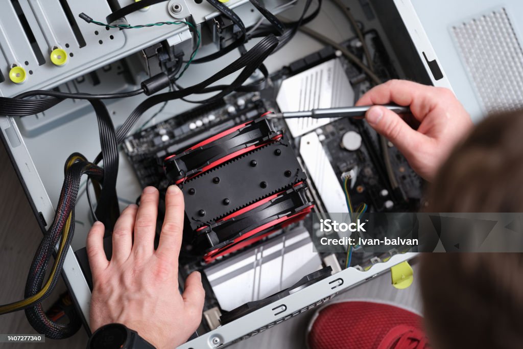 Repairman works with screwdriver and repairs computer equipment Repairman works with screwdriver and repairs computer equipment. Service maintenance of computer equipment concept Engineer Stock Photo