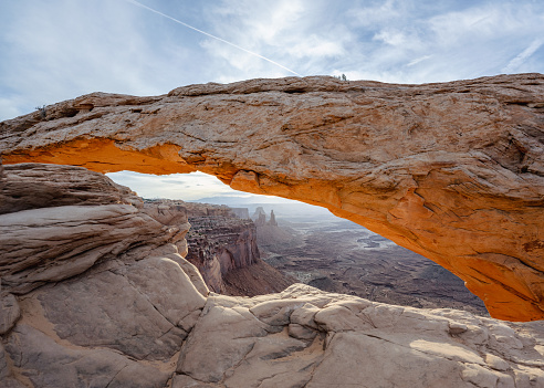 The sunrise at the Mesa Arch in the Canyonlands National Park makes the arch glow, Utah, USA.