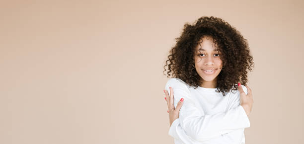 istock African american girl holding hands on shoulders 1407280104
