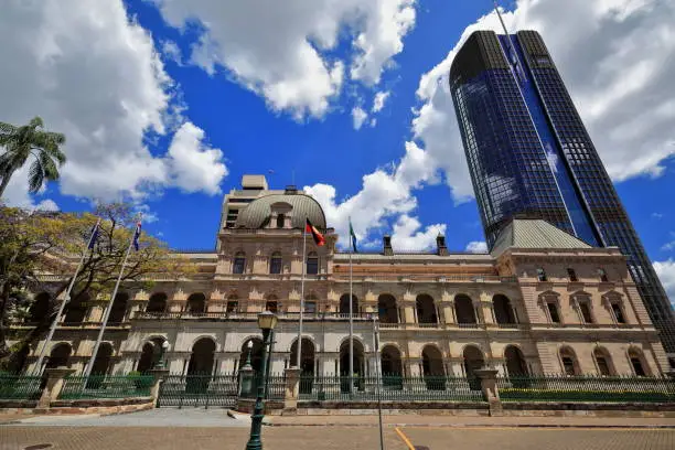 Photo of Parliament House backed by tall modern skyscraper-City Botanic Gardens. Brisbane-Australia-042