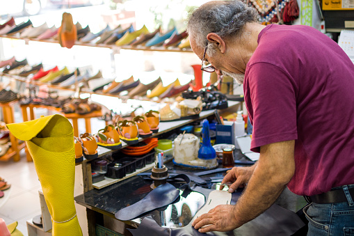 Shoemaker making shoes