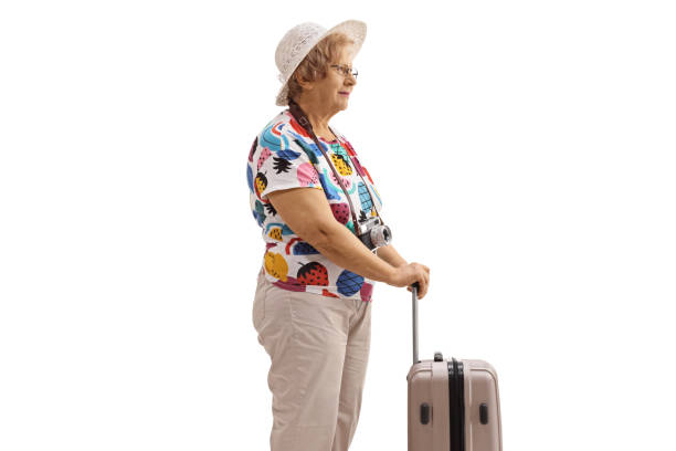 istock Elderly female tourist with a suitcase 1407283113